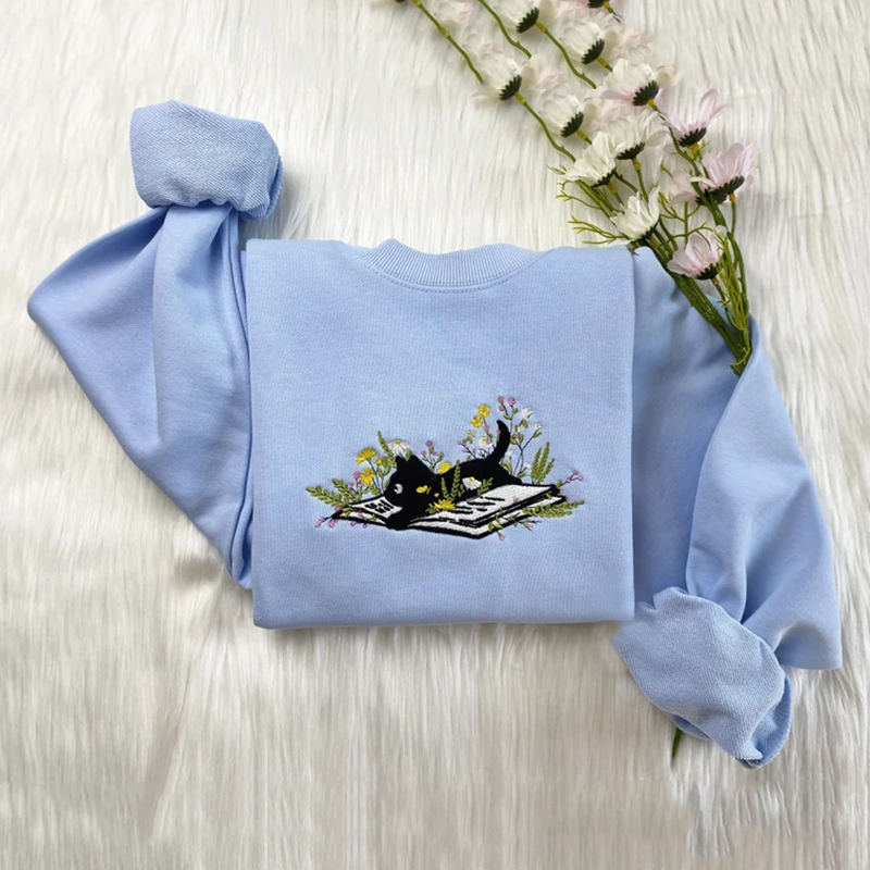 Cute Cat Lying On Book With Flower Embroidered Art Print Crew Neck Casual Sweatshirt elevenforest
