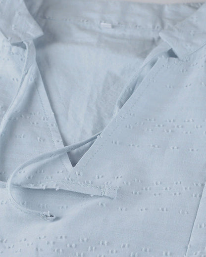 ER | Miniabito dalla linea ariosa con scollo a V, maniche a 3/4 e tasche