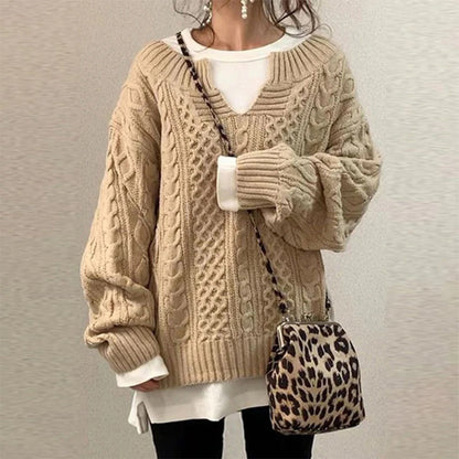 Maglione a trecce in cotone con scollo a chiave e pannelli a texture miste