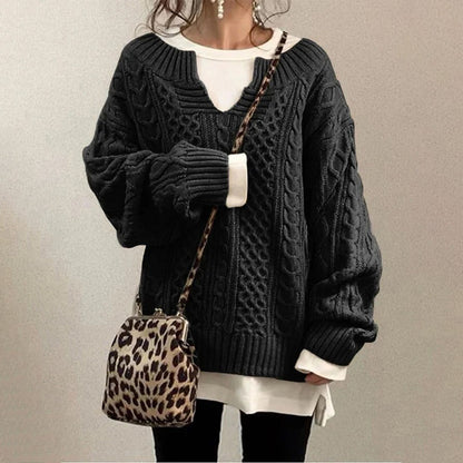 Maglione a trecce in cotone con scollo a chiave e pannelli a texture miste